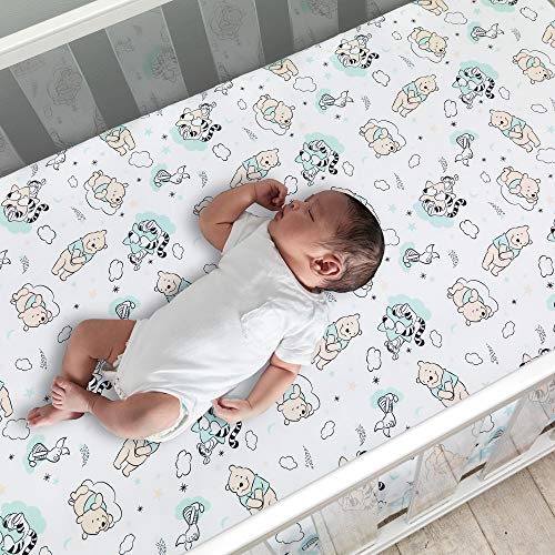 Winnie the Pooh Crib Bedding Set, Classic Pooh Nursery Quilt, Fitted Sheet, Crib Skirt, Soft Neutral Disney Baby Set 4 Product: Lambs & Ivy Disney Baby Winnie The Pooh Hugs 3-Piece Nursery Crib Bedding Set